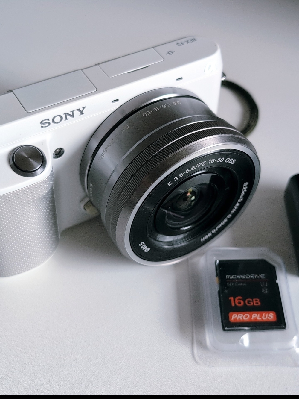 Sony White Mirrorless Camera with Black 16-50mm Lens